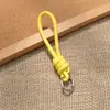 Bolsa de Corda de Couro PU Colorida Pingente Estilo Miu Simples Versátil Charme de Bolsa Chaveiro Acessório Lanyard de Celular Estilo Curto Novo