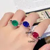 Anillo de Paloma de Huevo de Simulación Sencillo Versátil Esmeralda Incrustado con Diamante de Alto Carbono Anillo de Corindón Rojo Paloma Cristal Azul Puntiagudo para Mujeres