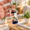 Llavero creativo acrílico cilíndrico con aceite y arena líquida flotante, lindo colgante de coche