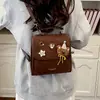Popular Textura Gamuza Elegante Para Ir al Trabajo Estudiante Simple Otoño Versátil Nicho Retro Mochila Doble Hombro 2026 Nuevo Estilo