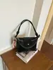 Bolso tejido de moda nicho para mujer, nuevo estilo de vacaciones en la playa, bolso versátil para el hombro y cruzado tipo 'dumpling' para el día a día