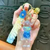 Llavero de Botella de Arena Líquida Oso Violento Relleno de Aceite Venta Caliente Transfronteriza Colgante de Coche Muñeca de Moda Bolso Exquisito Regalo Pequeño