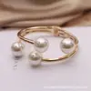 Fuente de joyería transfronteriza en stock pulsera de perlas apertura elástica metálica joyería al por mayor fábrica de joyería de comercio exterior yiwu