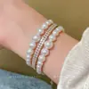 Pulsera multicapa de perlas con cuentas estilo francés, lujo ligero, moda de alta gama, diseño versátil y único, joyería minimalista de nicho