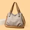 Bolsa modelo novo Vintage 2026 com padrão de lichia, bolsa tote feminina de grande capacidade, versátil e prática, adequada para usar no ombro ou na transversal