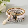 Bestseller transfronterizo estilo bohemio ojo turco borla colgante pulsera multicapa cordón elástico pulsera de cuentas