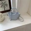 Bolsas de Tendencia de Moda Transfronterizas 2026 Verano Nuevo Popular Casual Bolso de Mano para Mujer Bolso Cruzado de Hombro Tipo Cubo