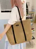 Bolsa de palha trançada transfronteiriça para mulheres, nova bolsa de palha casual da moda, bolsa de ombro tote simples e versátil de nicho para o verão de 2026