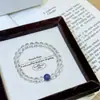 Pulseira de Cristal Branco Natural de Alta Qualidade Design de Nicho Acessórios Simples Feminina Cristal de Dragão Roxo Contas de Transferência Pulseira da Sorte