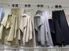 Traje de Punto Irregular para Mujer Otoño e Invierno Nuevo Transfronterizo Solapa Cinturón Cardigan de Longitud Media Pantalones de Pierna Ancha Conjunto de Dos Piezas