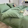 Venta al por mayor de fábrica Juego de cuatro piezas de algodón lavado de color liso Funda de edredón cepillada simple Estilo Ins Sábana de cama Juego de ropa de cama de tres piezas 3