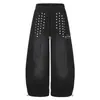 Pantalones de chándal holgados de pierna ancha en azul lavado con adornos de remaches verticales en ambos lados, bordado de estrella de cinco puntas y puños ajustables con cordón, unisex