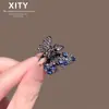 Nuevo y lujoso pasador de pelo de mariposa azul con incrustaciones de diamantes completos, pasador metálico para el flequillo de mujer de alta resistencia con adornos de diamantes, accesorio para el pelo de media coleta