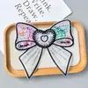 Nuevo Organza Color Mágico Lentejuelas Estéreo Lazo Dibujos Animados Ropa Infantil Accesorios para el Cabello Zapatos Sombreros Bolso Tela Adhesivos