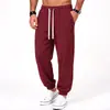 Coleção masculina nova AliExpress transfronteiriça: calças casuais de tecido canelado e sedoso, calças retas de corte solto com listras verticais e bolsos grandes