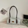 Bolsa feminina de design único para o dia a dia, novo modelo verão 2026, bolsa de mão estilo bowling, alto valor estético, bolsa de ombro color-blocking