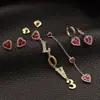 Dulces y de Moda Nuevos Asimétricos Amor Circonita Roja Diamante Denso Incrustado Exquisitos Pendientes Aguja de Plata S925 Románticos y Hermosos