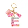 Moda Nuevo Rosa Pegamento Goteando Letra Llavero Lentejuelas Mariposa Borla Colgante Accesorios Colgantes de Bolso Venta al por Mayor