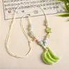 Collar con colgante de campana de mariposa de cerámica de estilo étnico retro para mujer, diseño nuevo y moderno, cadena larga para suéter, accesorios
