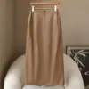 Moda Minimalista de Primavera: Saia Reta de Couro Lisa com Fenda Cor Sólida 2026, Saia Feminina Versátil e Emagrecedora