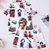 Comercio exterior transfronterizo juegos de pijama europeos y americanos para niños con cuello camisero, estampado de dibujos animados, tela ignífuga, ropa de casa de manga corta al por mayor