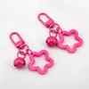 Llavero con Colgante de Campana de Estrella de Cinco Puntas de Colores Caramelo de Aleación Cubierta para Auriculares Decoración de Pareja