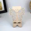 Soporte de Madera para Teléfono con Mariposa Transfronterizo Modelo Nuevo Mariposa Rosa Hueco Portátil para Escritorio Juego de Soportes para Teléfono