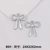Accesorios de joyería de aleación diy colgante de lazo aretes pulsera collar materiales de decoración para ropa cadena de suéter colgante