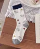 Meias fofas únicas e criativas para mulheres, meias de cano médio, meias longas de desenho animado de cachorrinho sem costura, estilo primavera e outono, meias da moda ins, absorventes de suor