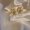 Pendientes geométricos de perlas y circonitas transfronterizos europeos y americanos, pendientes exquisitos de nicho de lujo ligero de alta gama, accesorios para orejas simples y elegantes para mujer