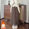 Saia de Arroz Glutinoso de Peso Elevado para Mulheres no Outono e Inverno Novo Visual Emagrecedor Cintura Alta Saia Evasê com Fenda Saia de Veludo Solta de Comprimento Médio