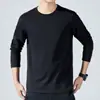 Camiseta de manga larga para hombre para primavera y otoño, estilo coreano, corte ajustado, color liso, cuello redondo, prenda base, moderna