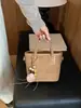 Bolsas pequeñas populares de comercio exterior para mujer 2026 nuevo bolso de moda versátil para hombro y cruzado, bolso de mano de cubo de alta calidad de moda