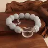 Pulsera bicolor de cristal azul natural y cristal rosa con diseño de oso y rosa, una pulsera blanca de lujo ligero y estilo antiguo fresco.