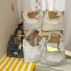 Un bolso de hombro de nicho y versátil, un bolso tote de gran capacidad para mujer, perfecto para ir al trabajo, y un nuevo y moderno bolso tote para mujer en 2026