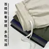 Venta directa de fábrica transfronteriza de pantalones cortos casuales de lino para hombre de longitud media, nuevo estilo verano 2026, pantalones cortos holgados y transpirables al por mayor