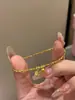 Pulsera de cuerda elástica con cuentas redondas de flor de oro rota personalizadas, cuentas disco, pulsera de cuentas de oro pequeñas de moda de lujo ligero para mujer