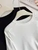 Camiseta blanca de manga larga para mujer, hecha de algodón lyocell, corte holgado, adecuada para usar como prenda exterior, con diseño de manga raglán