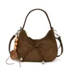 Bolso de axila retro estilo coreano con lazo de gamuza 2026 para mujer, un bolso de mano de nicho y sofisticado que se puede llevar en la mano, usar como bolso de hombro o colgar cruzado.