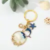 Llavero Serie Océano Azul de Verano Estrella de Mar Caliente Europea y Americana Delfín Concha Llavero con Goteo de Aceite Colgante para Bolso
