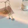 Collar con colgante geométrico de mariposa y circón en capas, estilo gota de agua azul, cadena doble con diseño de viento frío para clavícula.