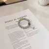 Pulsera de Hilo Plateado Original Natural Vintage Gris Lunar de la Luna con Borla de Lirio del Valle de Personalidad Fresca y Única