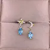 Aretes de Topacio Azul Suizo Plata S925 Incrustados con Diamantes Exquisita Doble Estrella Dorada y Luna Ab Color Tesoro Aretes de Plata