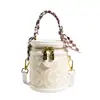 Bolsa balde pequena com design em relevo, bolsa de mão feminina, nova do Verão 2023, alta qualidade, textura, bolsa de ombro transversal feminina