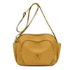 Bolsa de ombro feminina estilo通勤 2026 verão nova casual simples bolsa transversal atacado transfronteiriço tecido composto de nylon