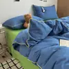 Lujo ligero, simple y suave, juego de cuatro piezas de ropa de cama para el hogar de estilo Muji catiónico con cordón para dormitorio estudiantil - un regreso a la simplicidad