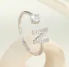 Anillo de Luz de Zirconia Incrustada en Oro Real Chapado en Cobre Transfronterizo Europeo y Americano Lujo Ligero Sensación de Alta Gama Anillo para el Dedo Joyería de Mano Versátil Fabricante Venta al por Mayor en Stock