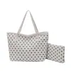 A popular bolsa de balde fresca portátil deste ano para mulheres, novidade de verão 2026, elegante bolsa de ombro único de bolinhas, bolsa para mãe e filho de axila