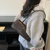 Bolso de Hombro Minimalista Retro de Nicho para Mujer 2026 Elegante Nuevo Estilo Versátil para el Trabajo Bolso Baguette