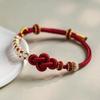 Flor de durazno Nudo Ruyi pulsera de cuerda roja tejida a mano producto terminado ponible accesorios DIY joyería de orquídea dorada